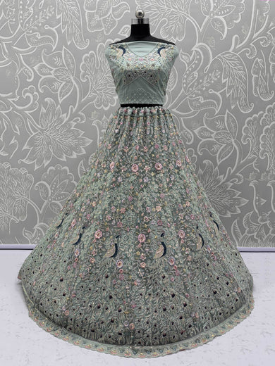 Dazzling Sky Blue Net Zari Embroidered Reception Wear Lehenga Choli